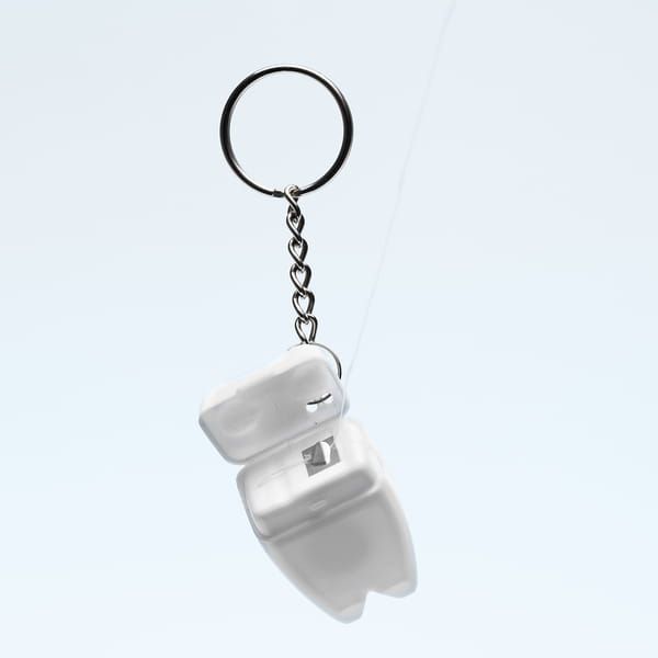 Brelok Toothy z nicią dentystyczną biały