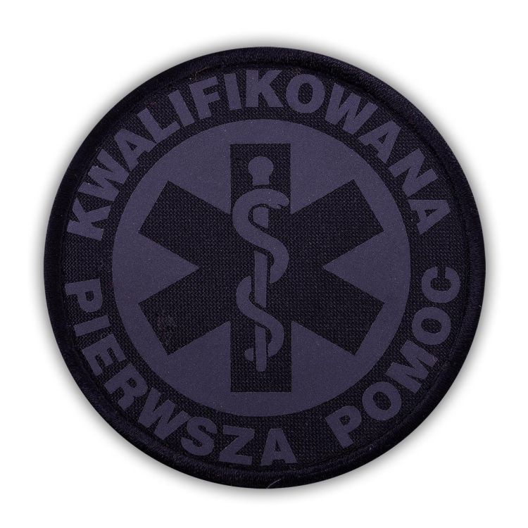Emblemat CZARNY odblaskowy KWALIFIKOWANA PIERWSZA POMOC na rzepie 8,5 cm